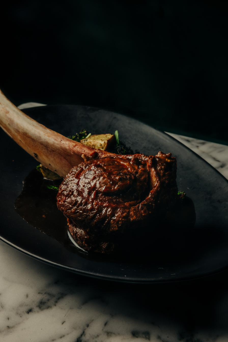Charcoal-grilled short rib tomahawk for a private event at Cherryfish, Pacific Beach San Diego